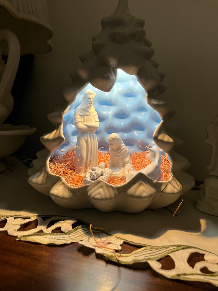 ceramic manger scene illuminated